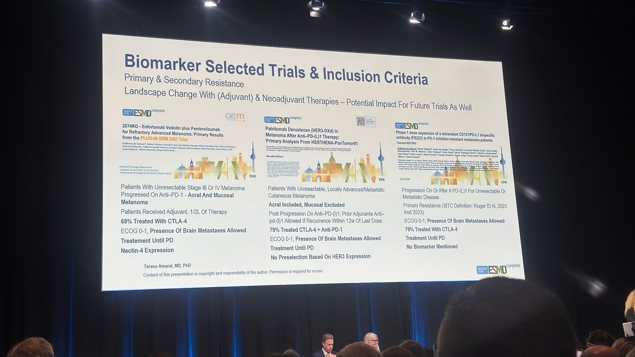 Mario Balsa ESMO 2026 slide photo: discussion slide by Teresa Amaral comparing inclusion criteria of PLUG-IN GEM 2301 (enfortumab vedotin plus pembrolizumab), HERTHENA-PanTumor01 (patritumab deruxtecan) and FS222 in melanoma after anti-PD-1